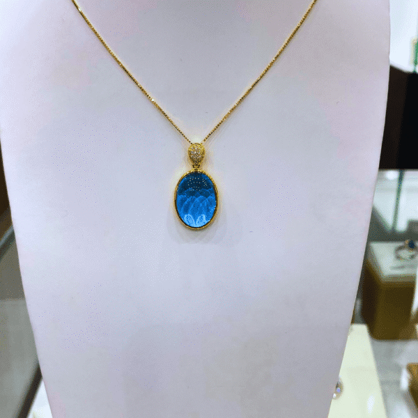 16.07 Ct Blue Topaz & 0.06 Ct Diamond Pendant in 18K Gold